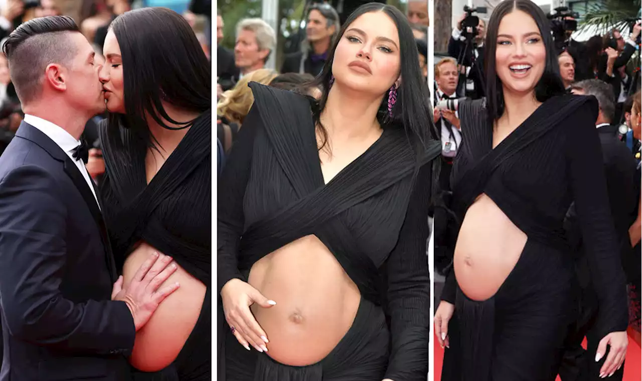 Pregnant Adriana Lima causes a stir as model exposes baby bump at Cannes' Top Gun premiere