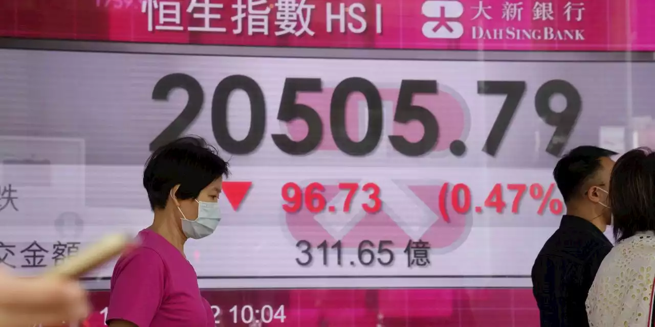 Asian markets mixed after Powell warns of further rate hikes