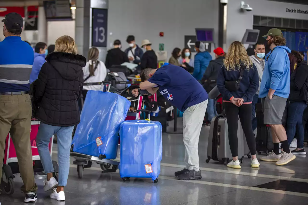 Long waits on the plane await travellers as airports work out the kinks