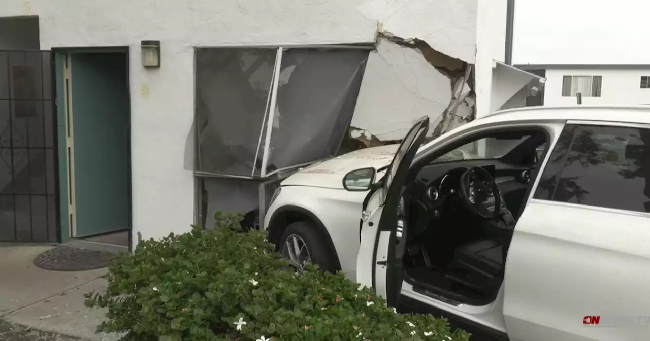 Driver accidentally slams into National City apartment building after having leg cramp