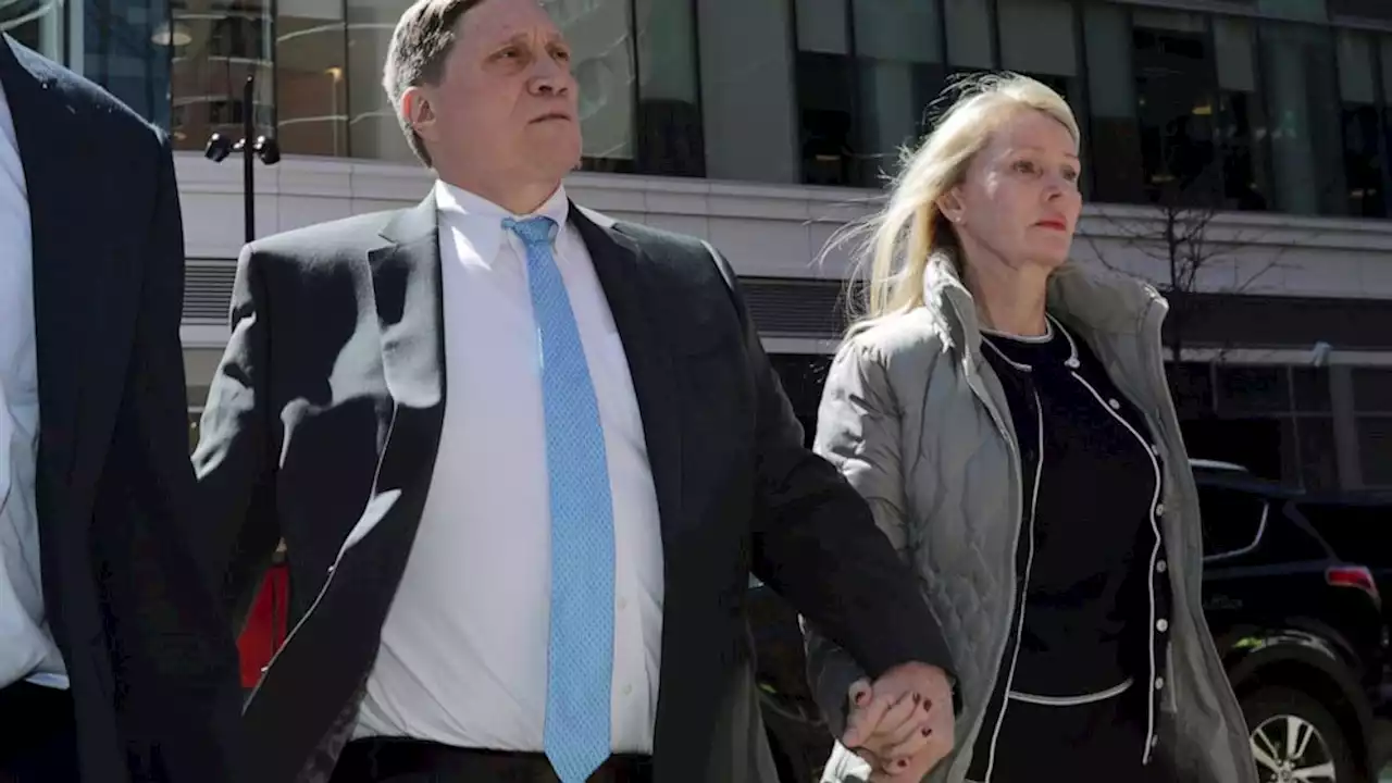 Parents convicted in college scam remain free during appeal