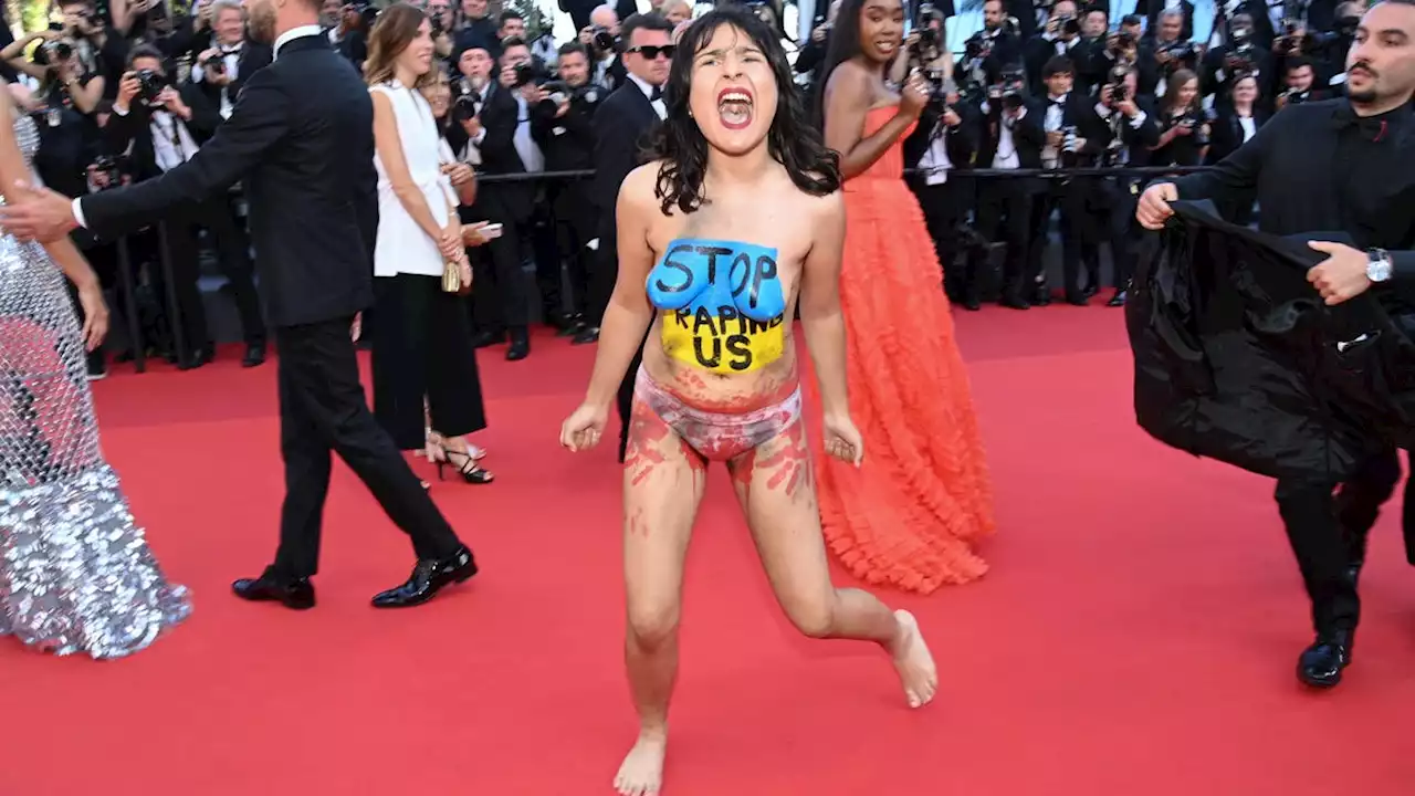 Activist Crashes Cannes Red Carpet to Protest Rape in Ukraine