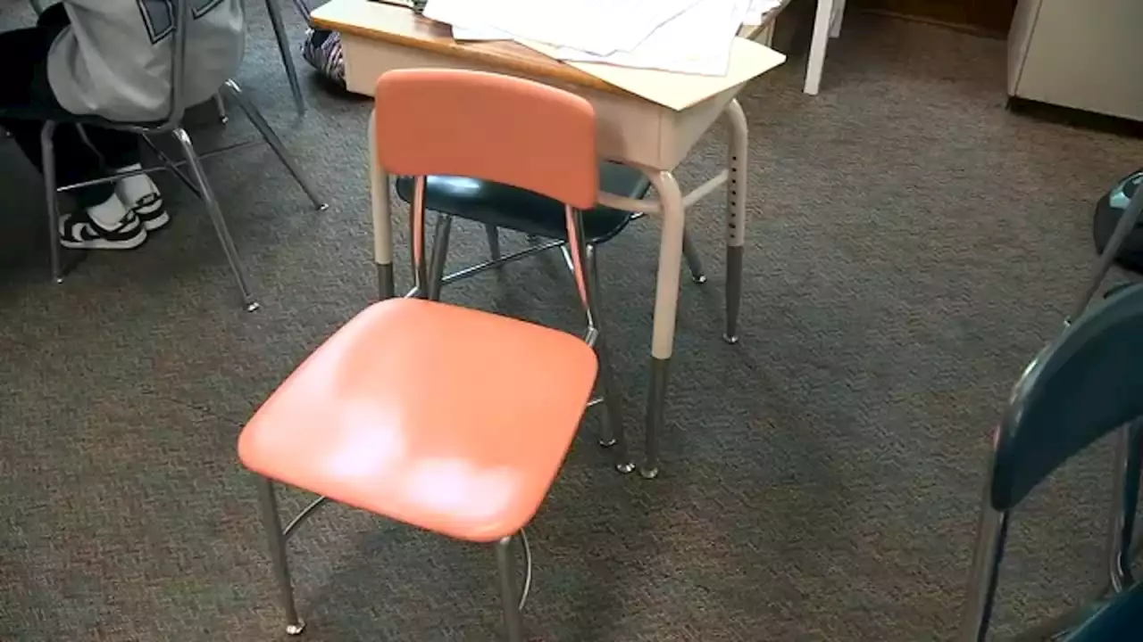 Why a New Jersey teacher has kept an empty chair in his classroom for 52 years