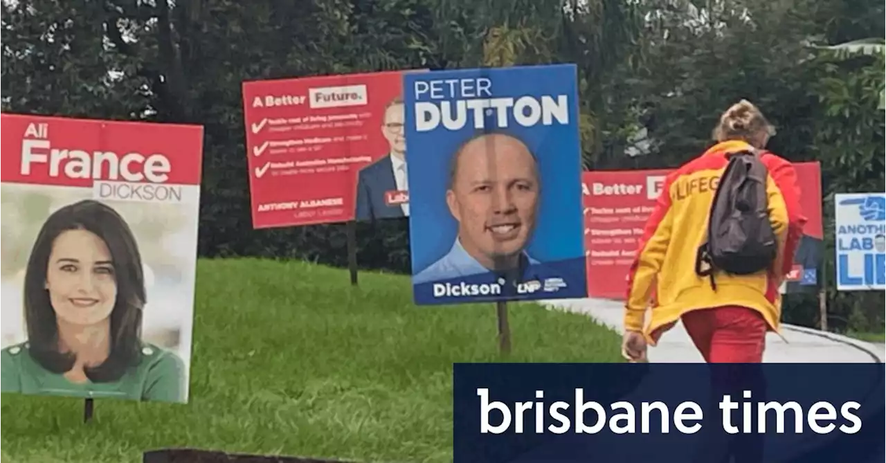 Queenslanders vote amid wet weather, flood alerts