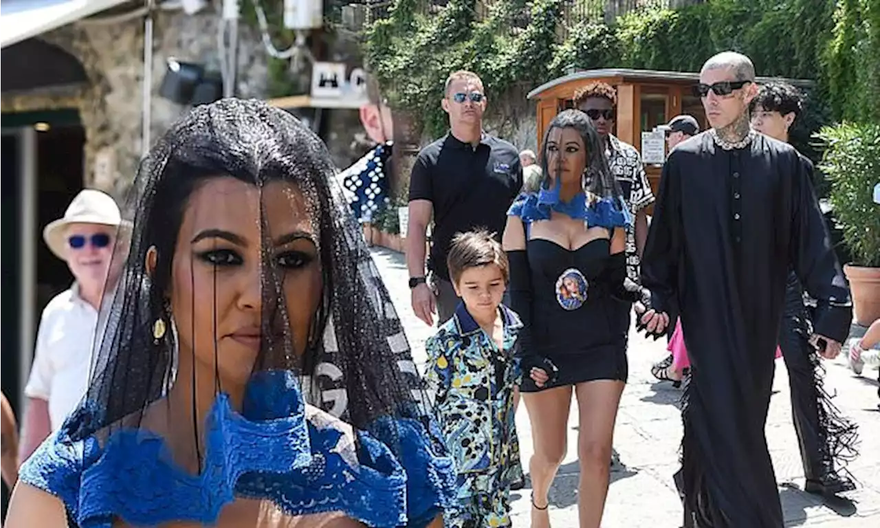 Kourtney Kardashian puts on a busty display in minidress and veil