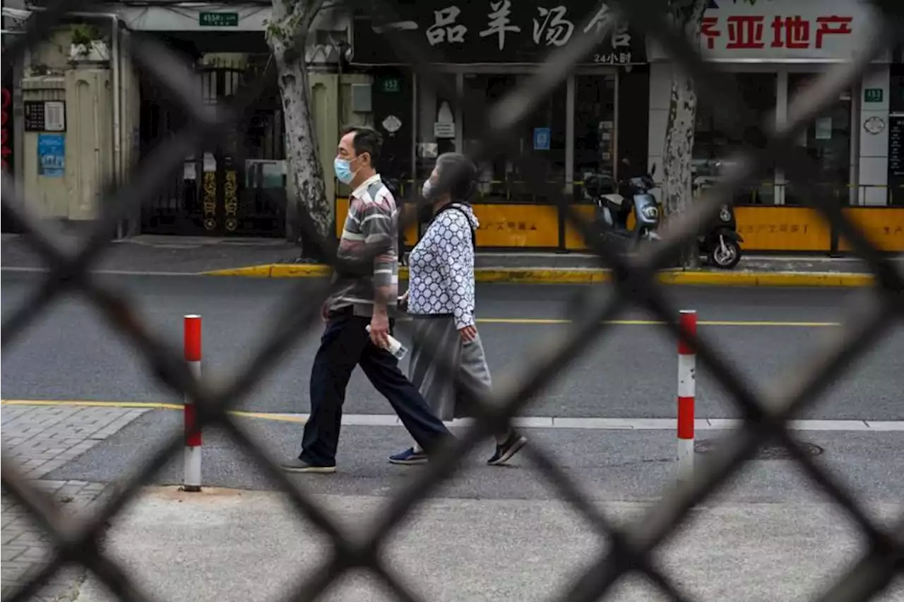 Shanghai district to require all shops to shut, residents to stay home