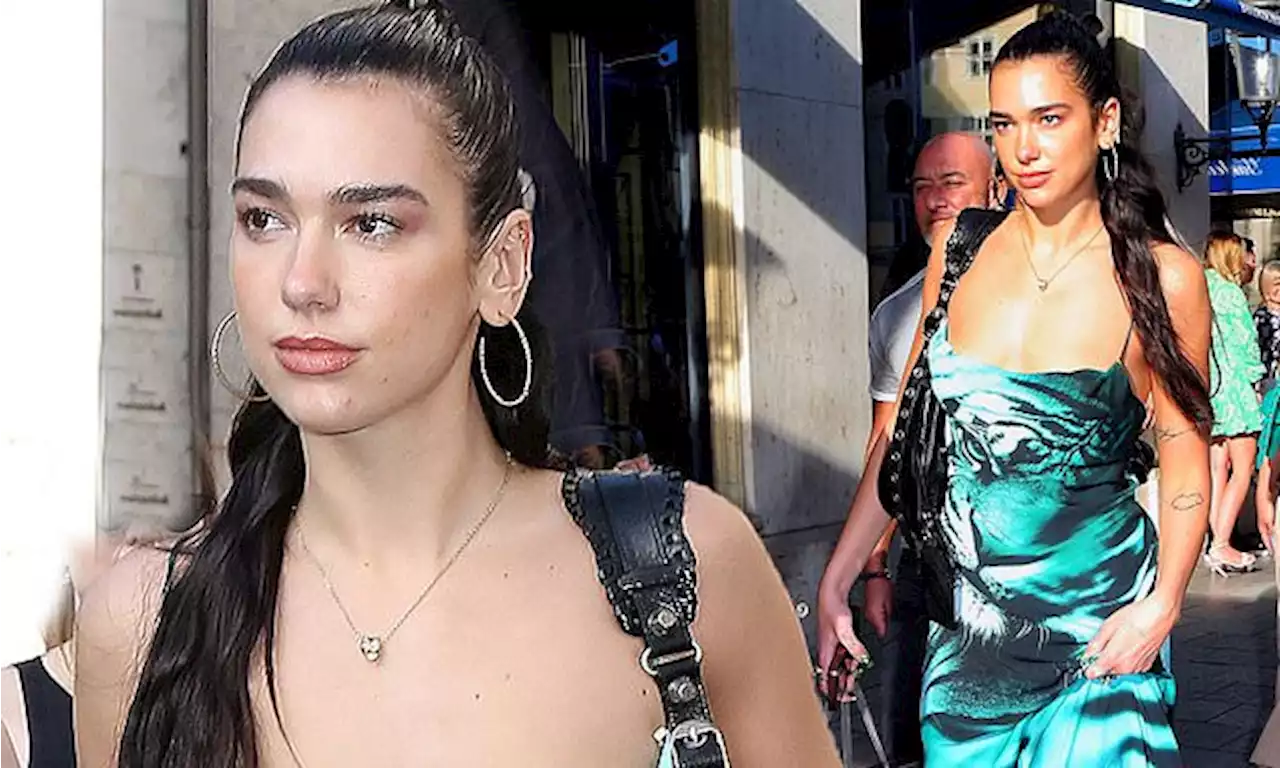 Dua Lipa nails gothic chic in a midi dress as she strolls Munich