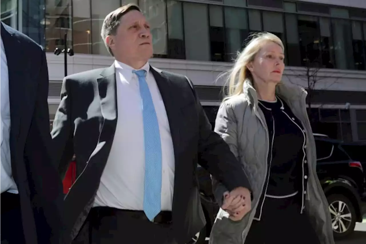 Parents convicted in college scam remain free during appeal