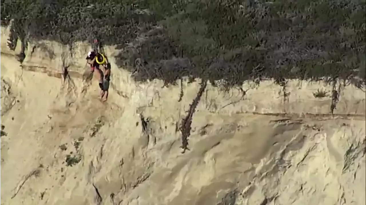 CAUGHT ON CAM: Man hanging on side of cliff rescued by flight crews