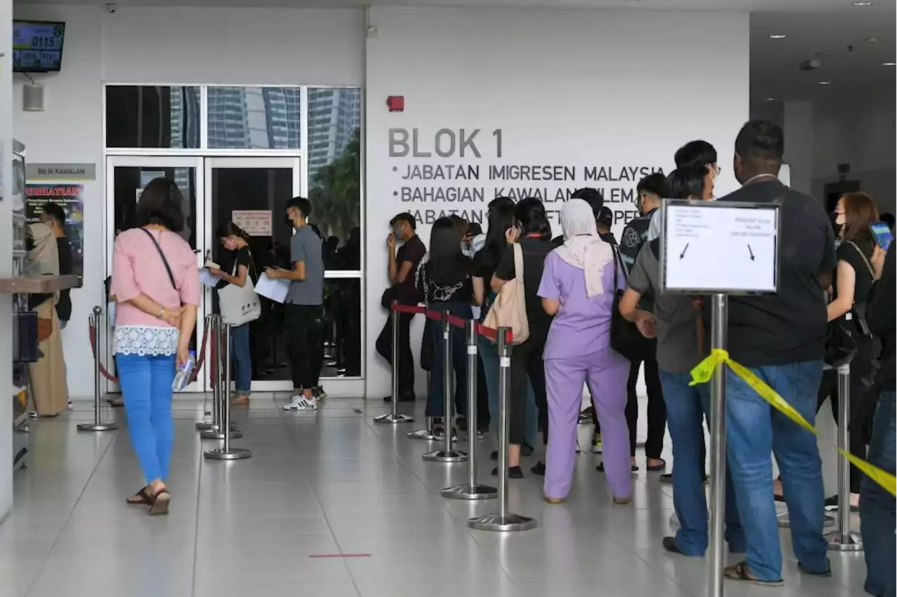 In Johor, long queues await visitors to immigration office at Home Ministry Complex in Setia Tropika
