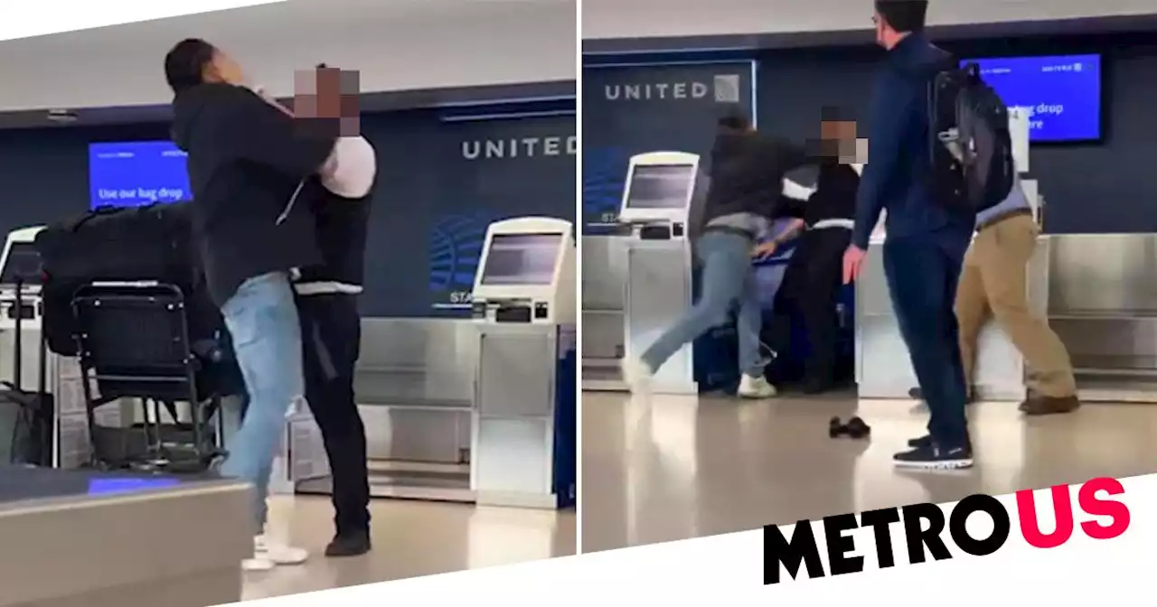 Moment United Airlines worker punches passenger before being knocked over