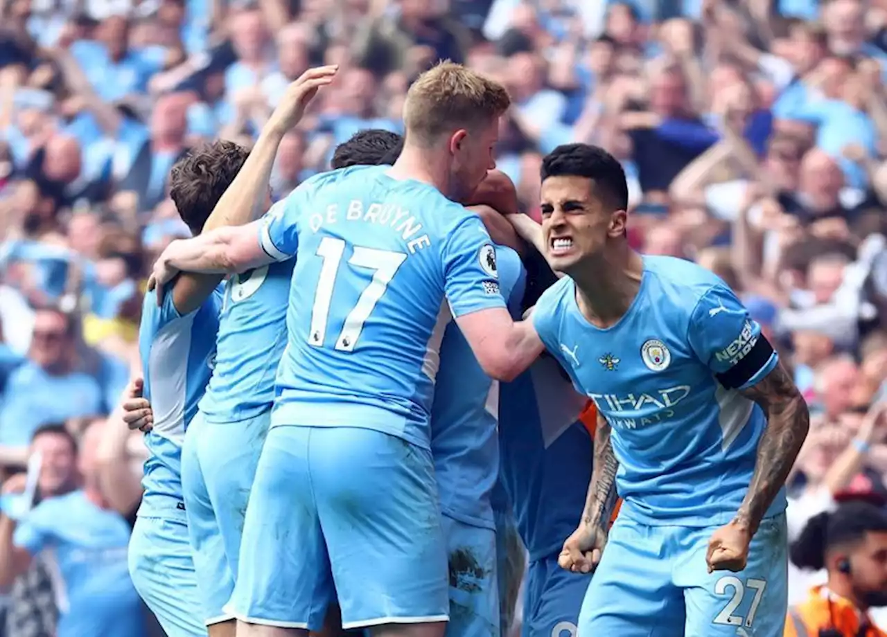 Soccer-Man City fight back to win title, Spurs take fourth