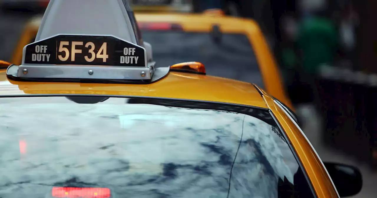 Taxi and rideshare drivers rally outside City Hall in support of raising meter rates