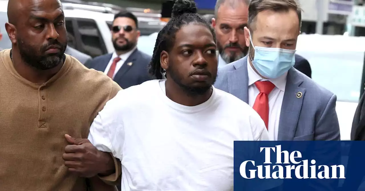 Suspect in New York subway shooting turns himself in to police