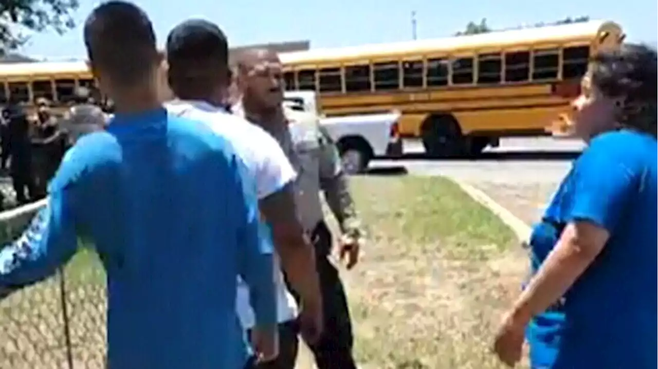 'Let us do this!' Parents try to storm school