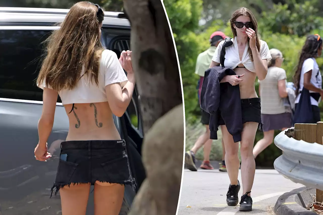 Julia Fox gets cheeky in super-short skirt and twisted crop top