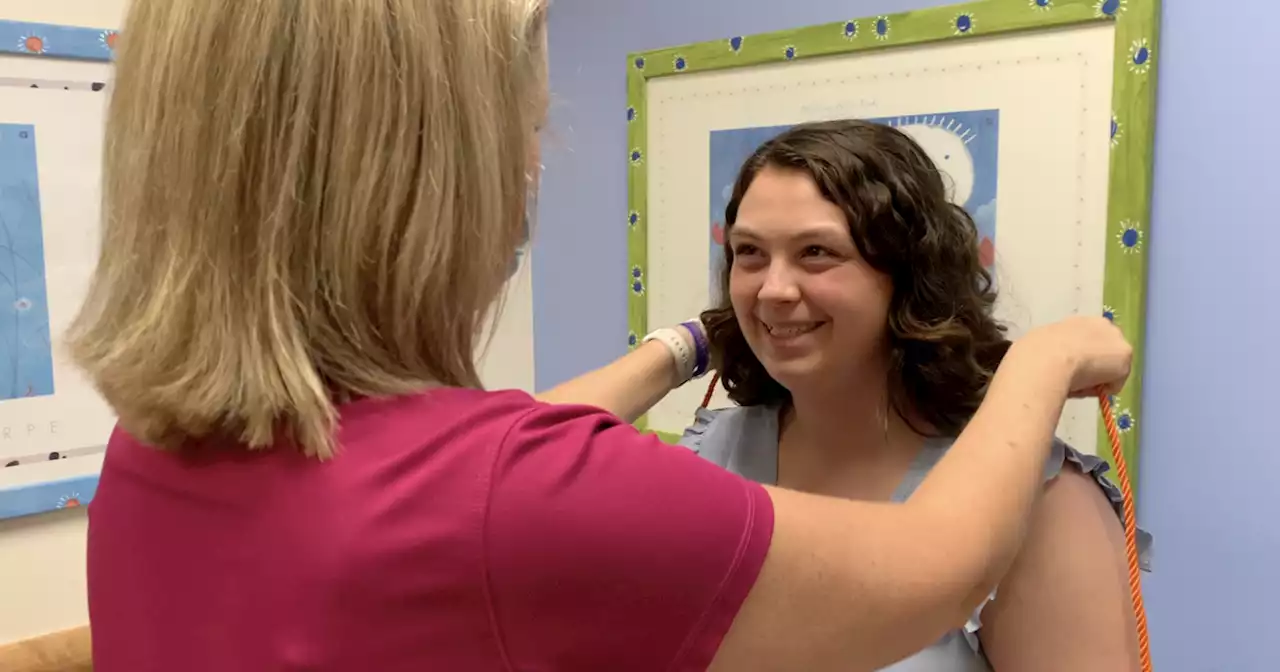 Local cancer survivor graduates high school with honors