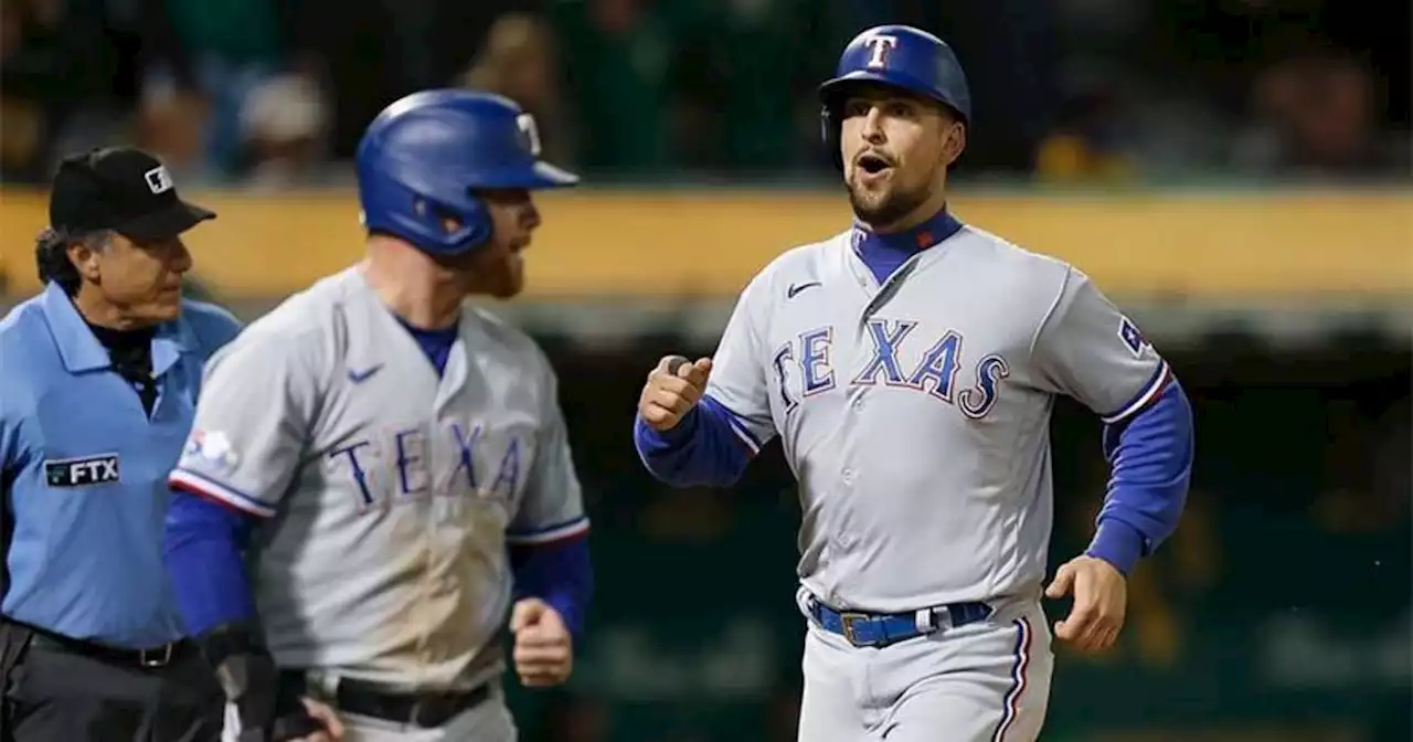 Rangers rally in 9th again to beat A's 8-5 for 3rd in row