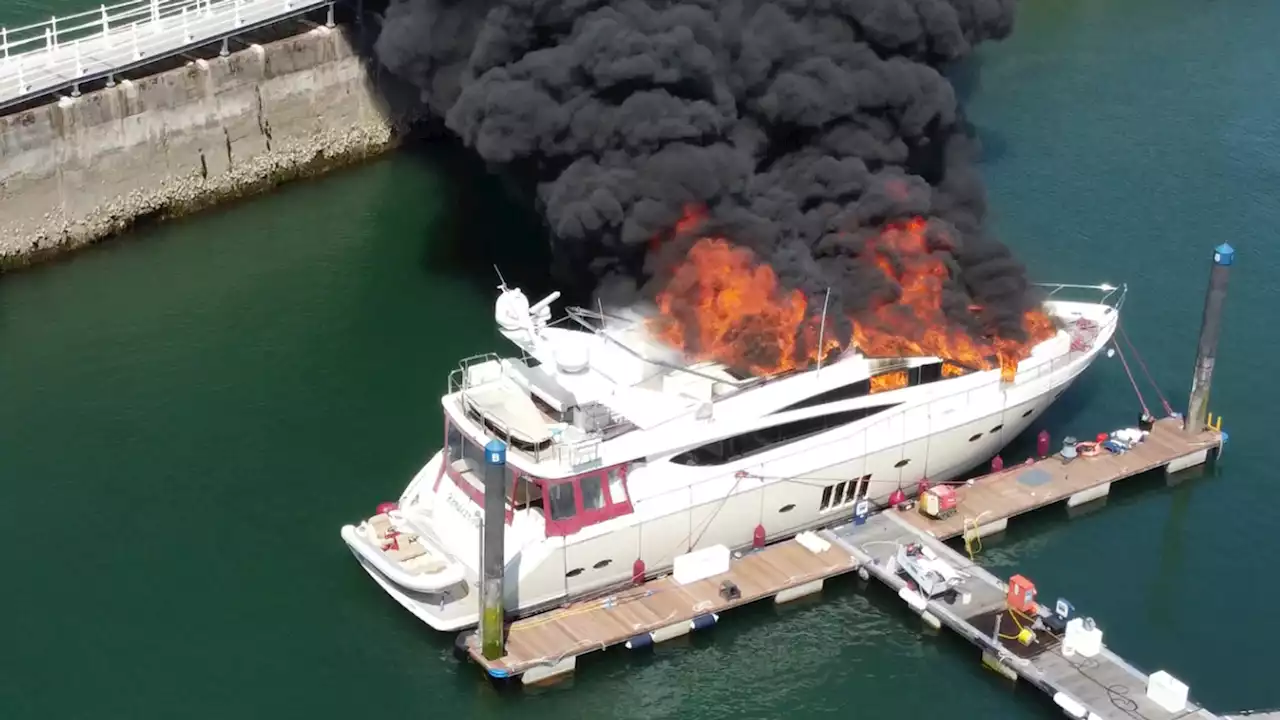 Superyacht: Race to prevent oil spill after fire-ravaged vessel sinks