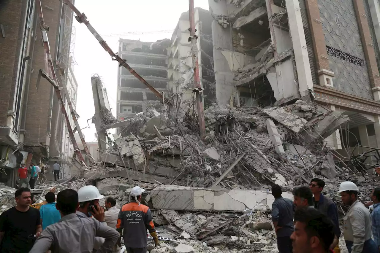 Crowd confronts emissary at Iran tower collapse that killed 31