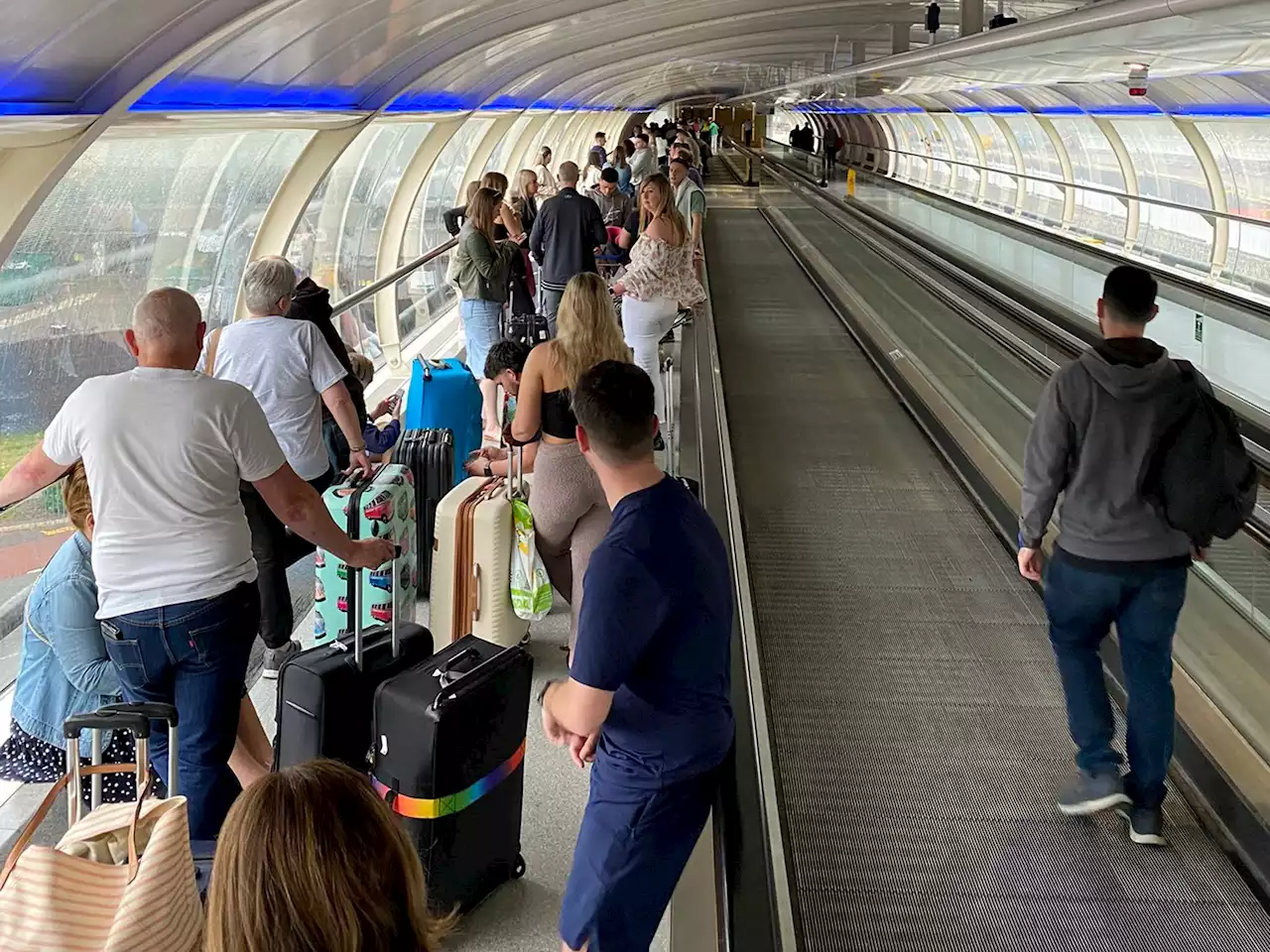 Passengers arrive to huge airport queues in latest travel chaos - live