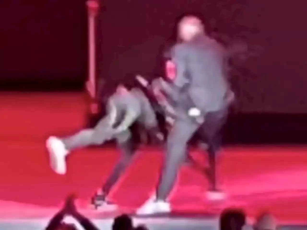 Man with replica gun tackles Dave Chappelle on stage during Netflix comedy festival