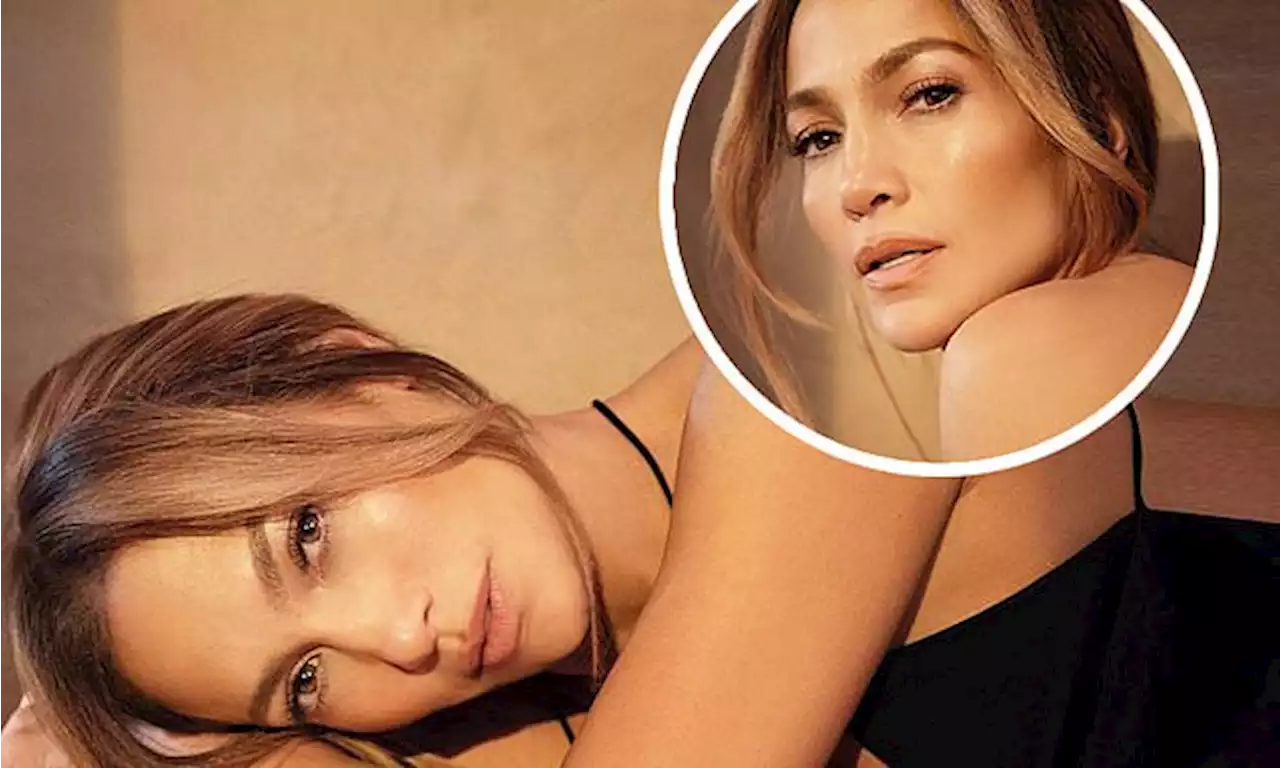 Jennifer Lopez is radiant in plunging top as she plugs beauty line