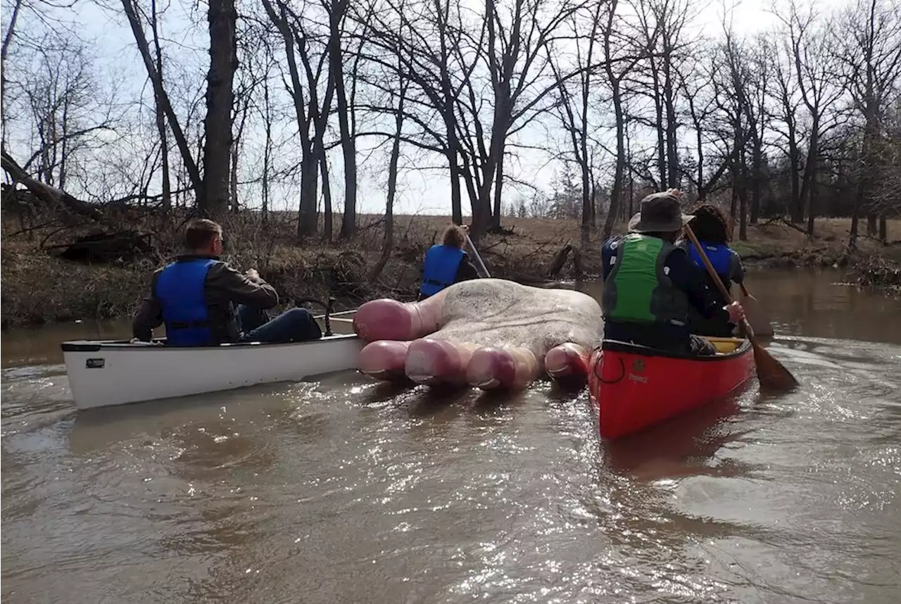 Paddlers locate statue of giant hand that was carried away by swollen Manitoba river