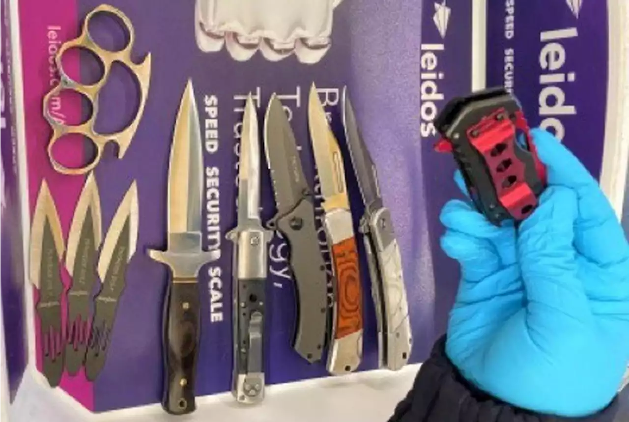 TSA officers find 23 weapons in man's carry-on bag at Virginia airport