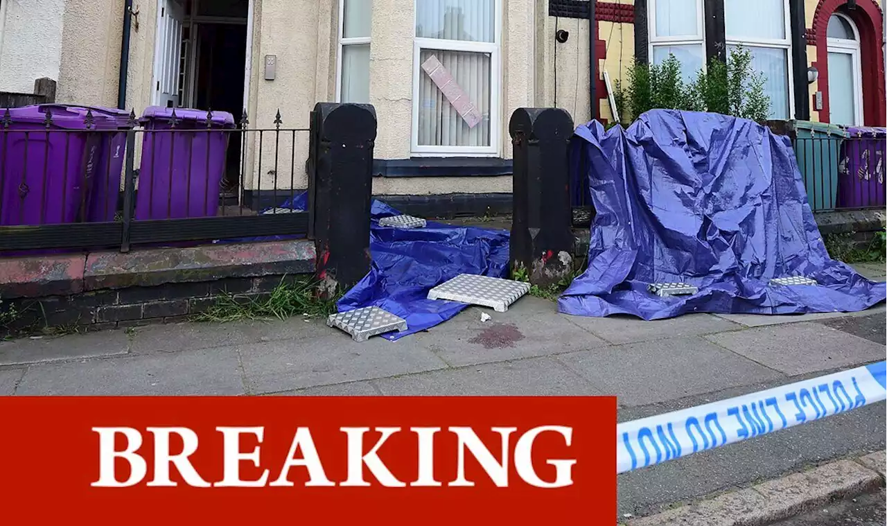 Police swarm street and launch murder probe after man plunges from window