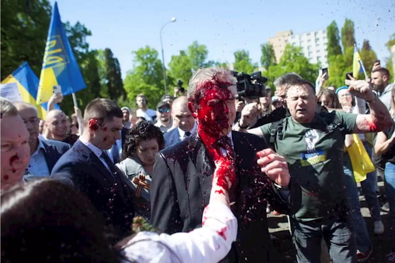 Russian envoy to Poland hit with red paint at war cemetery