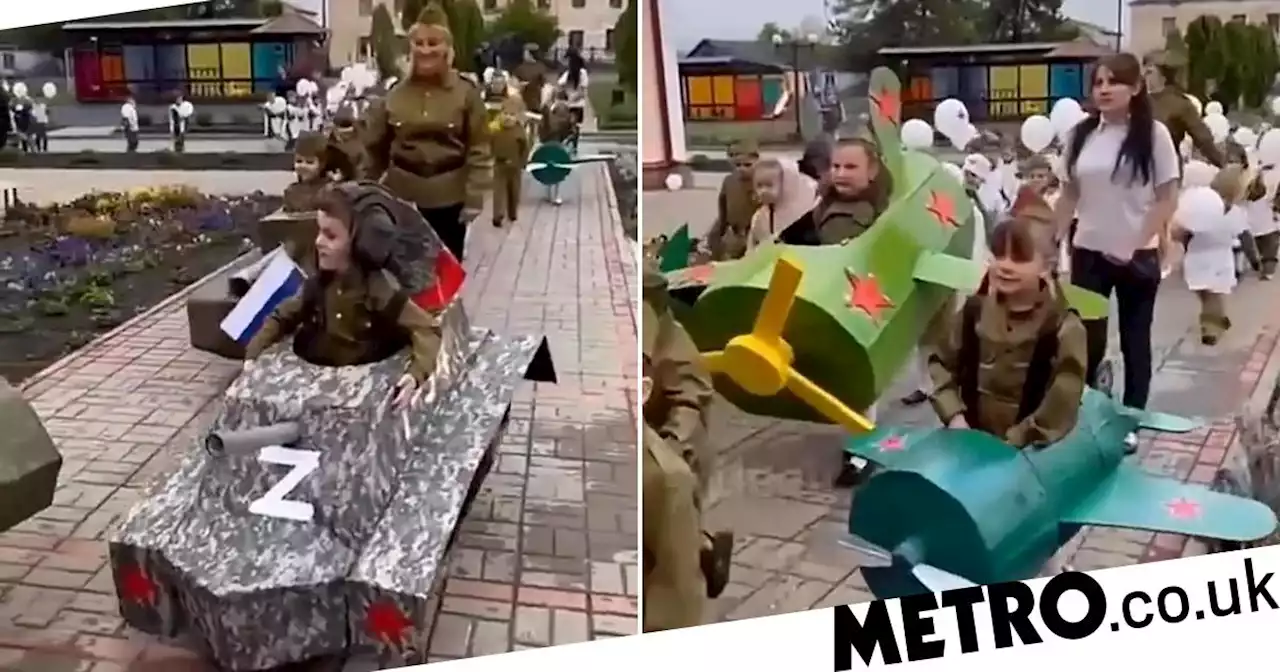 Russian children dressed as soldiers and tanks with Z symbol for Victory Day