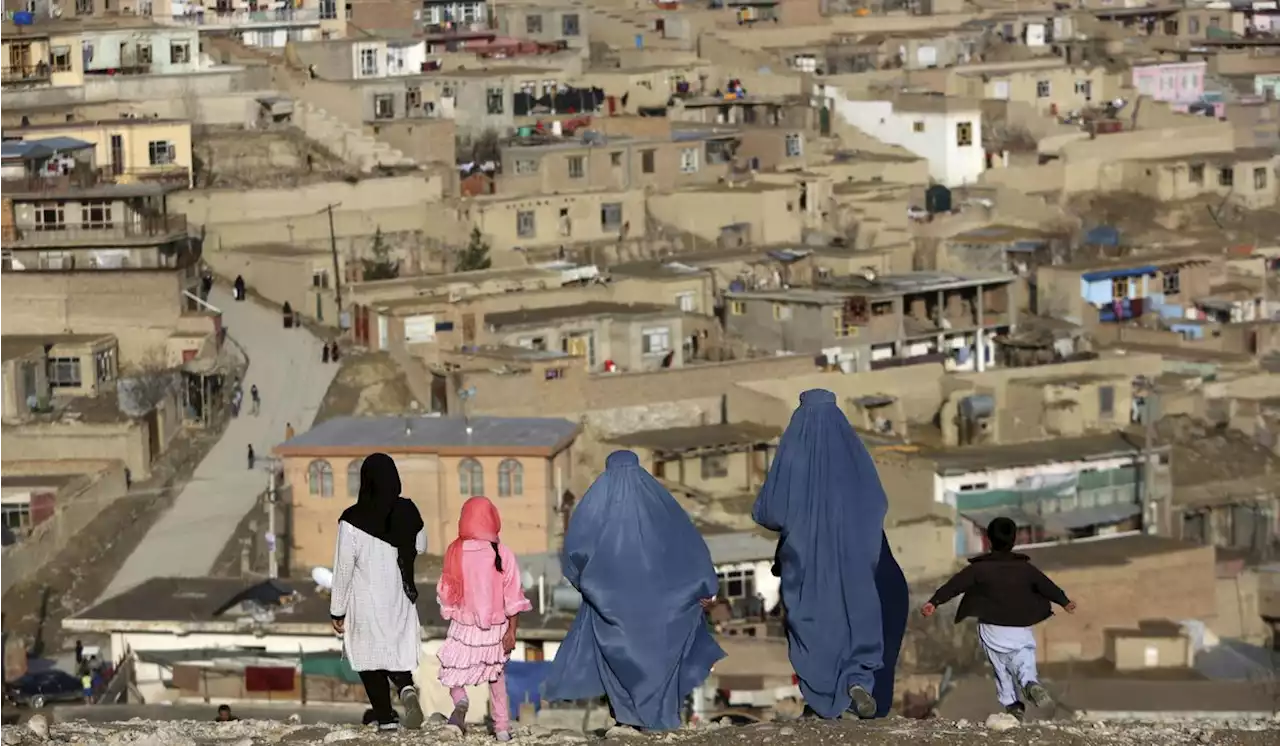 Afghanistan’s Taliban order women to cover up head to toe