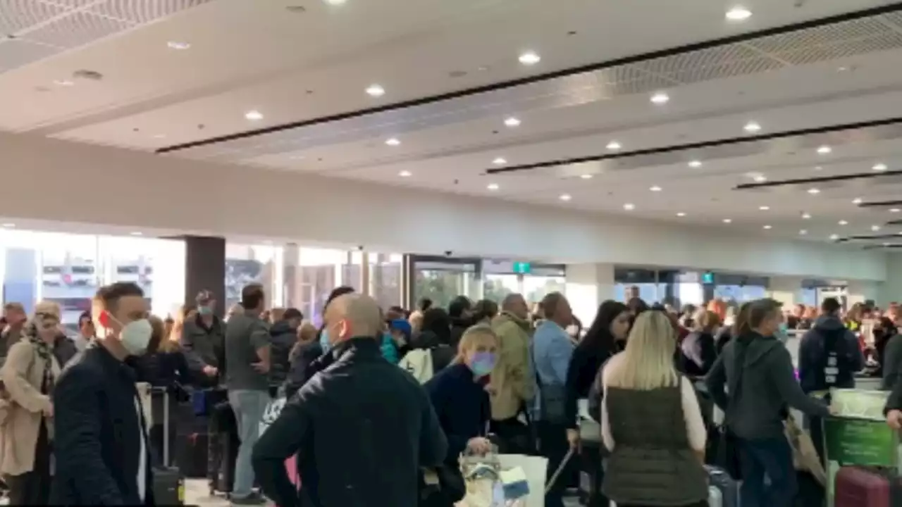 Travellers confronted by big queues at Melbourne airport ahead of long weekend