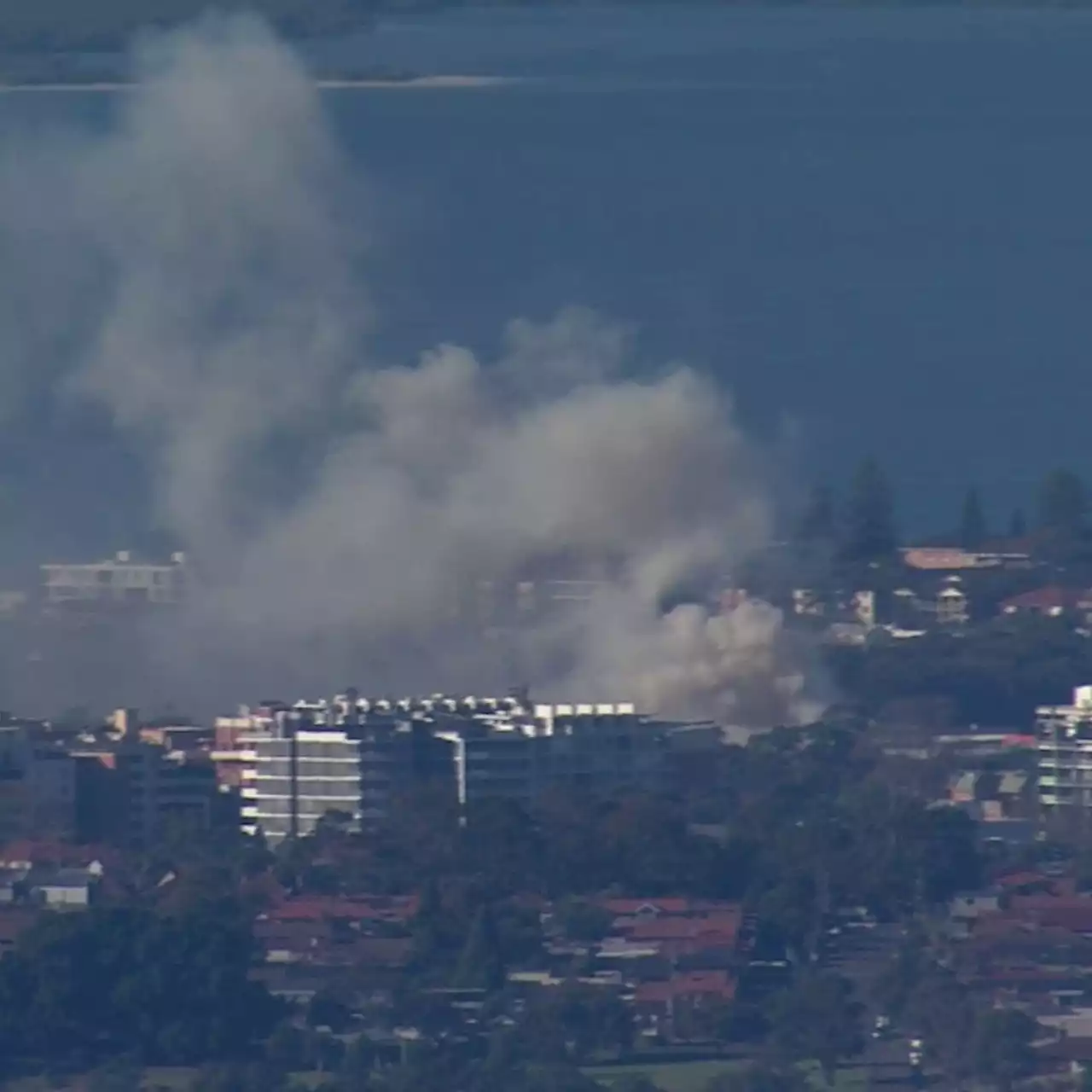 Smoke billows across Sydney after rubbish warehouse fire