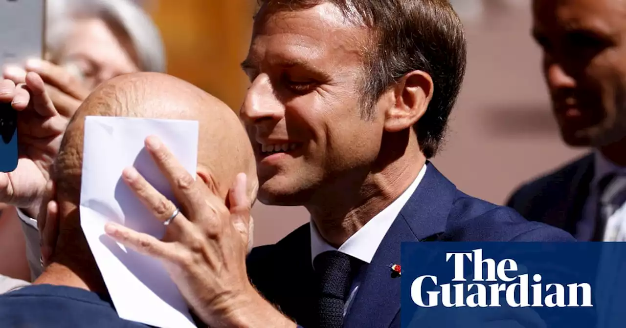 Will a kiss on the head bring victory for Emmanuel Macron?