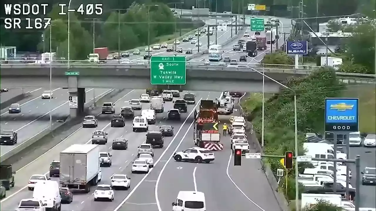 Truck pulling backhoe damages I-405 bridge in Renton