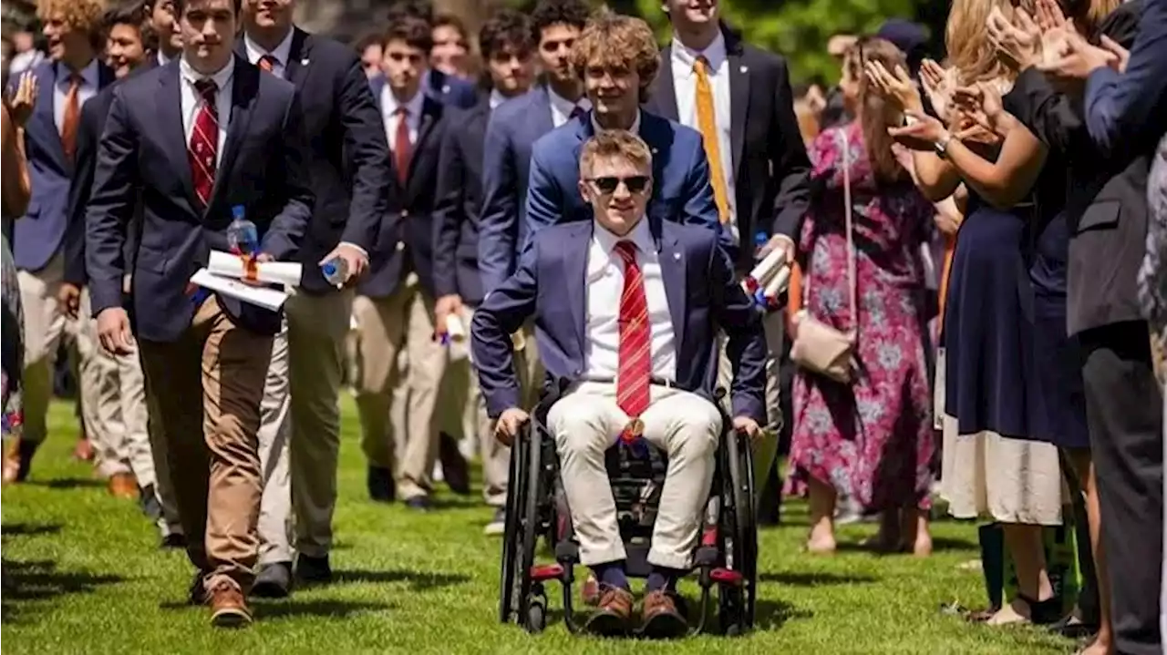 WATCH: Paralyzed teen walks across stage to get high school diploma