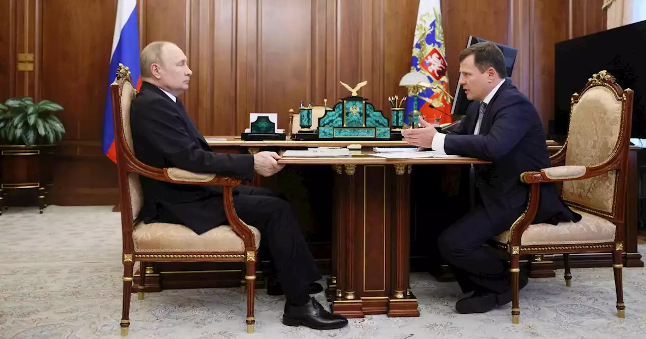 Putin grabs table so hard his hand bulges with veins in tense TV appearance