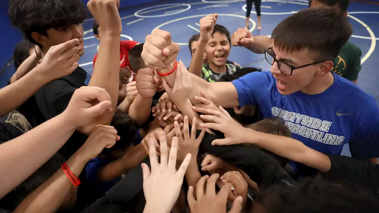 Photos: Sunnyside High School wrestlers offering help on the mat and in the classroom