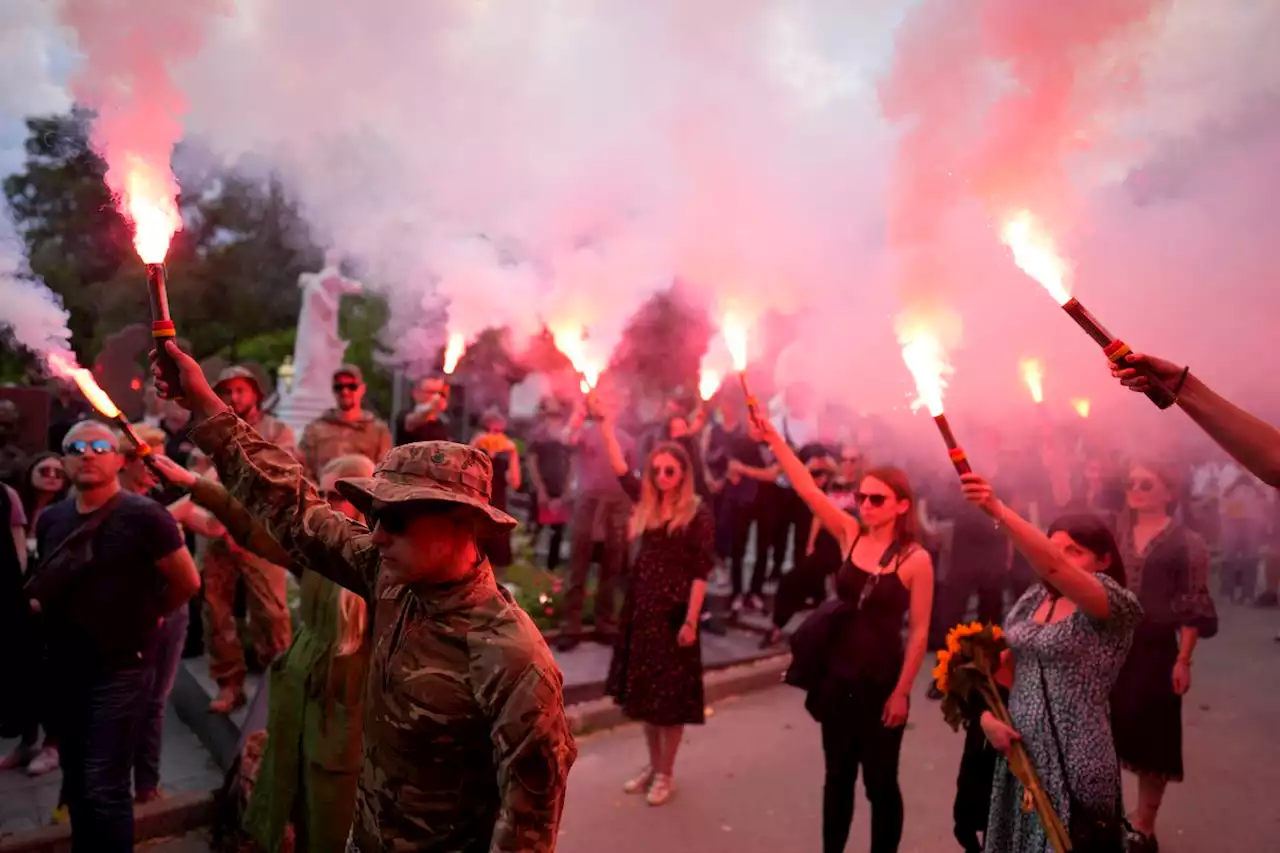 Hundreds gather in Ukraine for funeral of activist killed and mourned in war