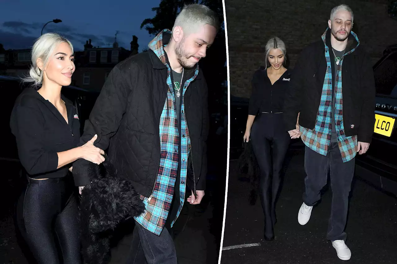 Kim Kardashian and Pete Davidson hold hands as they arrive in the UK