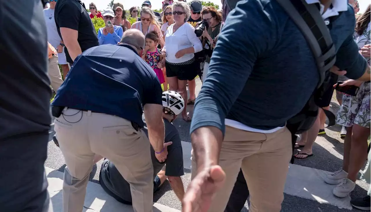 Biden takes spill while getting off bike after beach ride