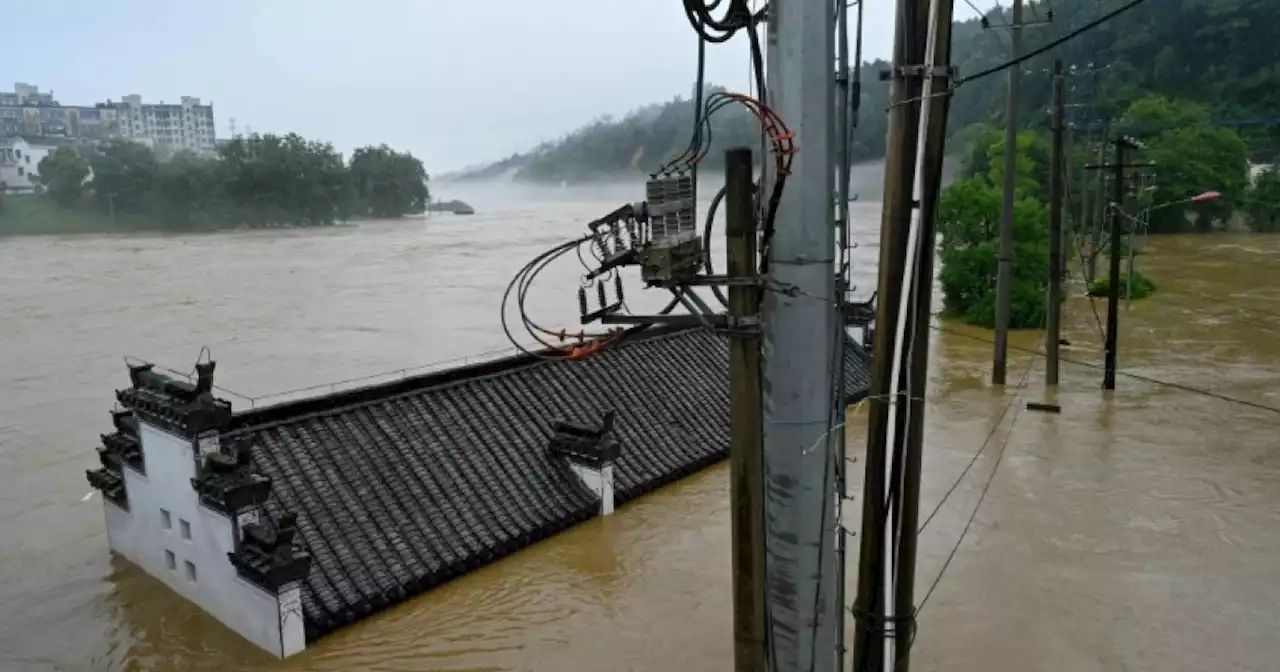 Hundreds of thousands evacuated in China after heaviest rains in decades