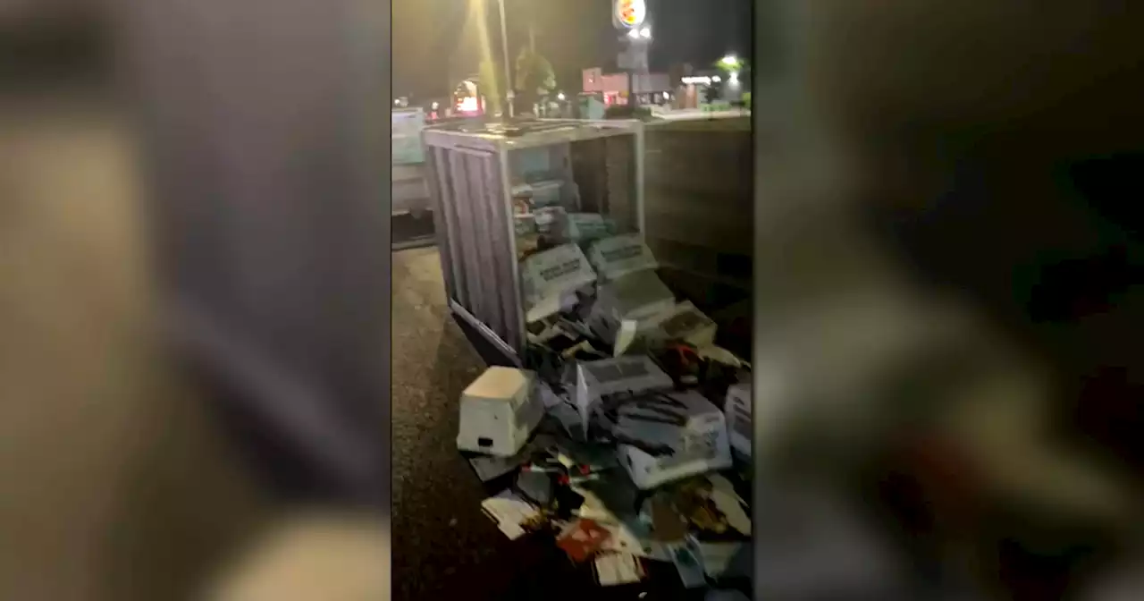 Cartons of mail left in street in southwest suburbs after being spilled by U.S. Postal Service truck