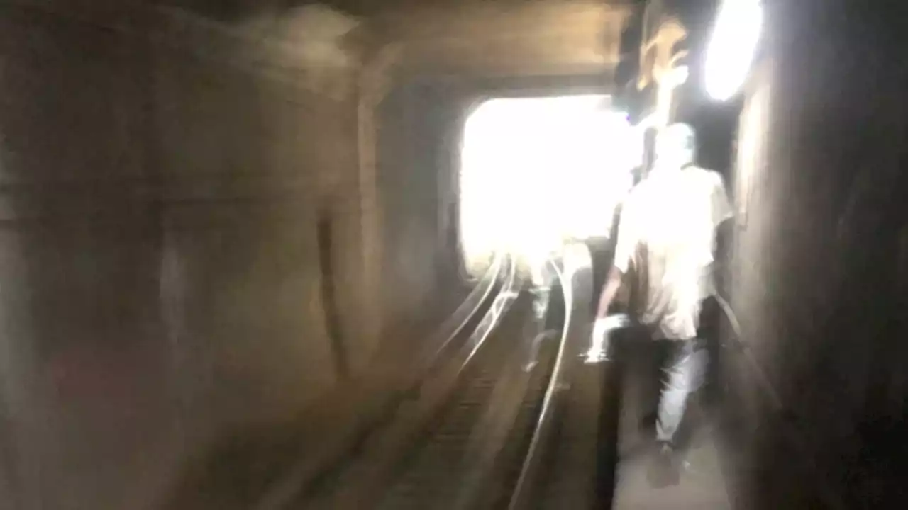 Chicago CTA riders exit stopped train due to heat, walk down subway tunnel to station