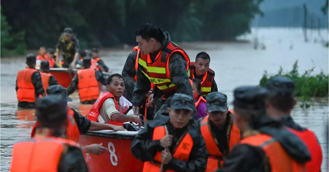 China heatwaves drive up power demand to record levels, southern floods swamp cities