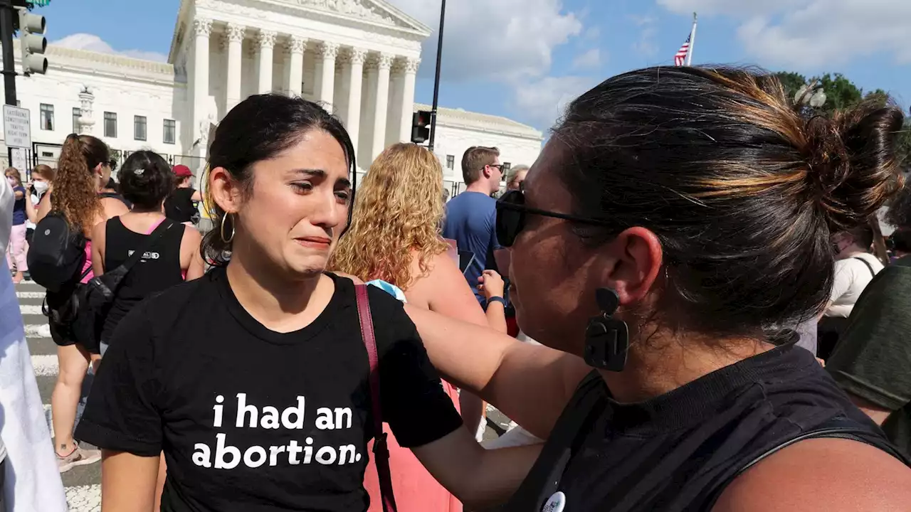 Tears of joy and of despair after Supreme Court overturns Roe v Wade