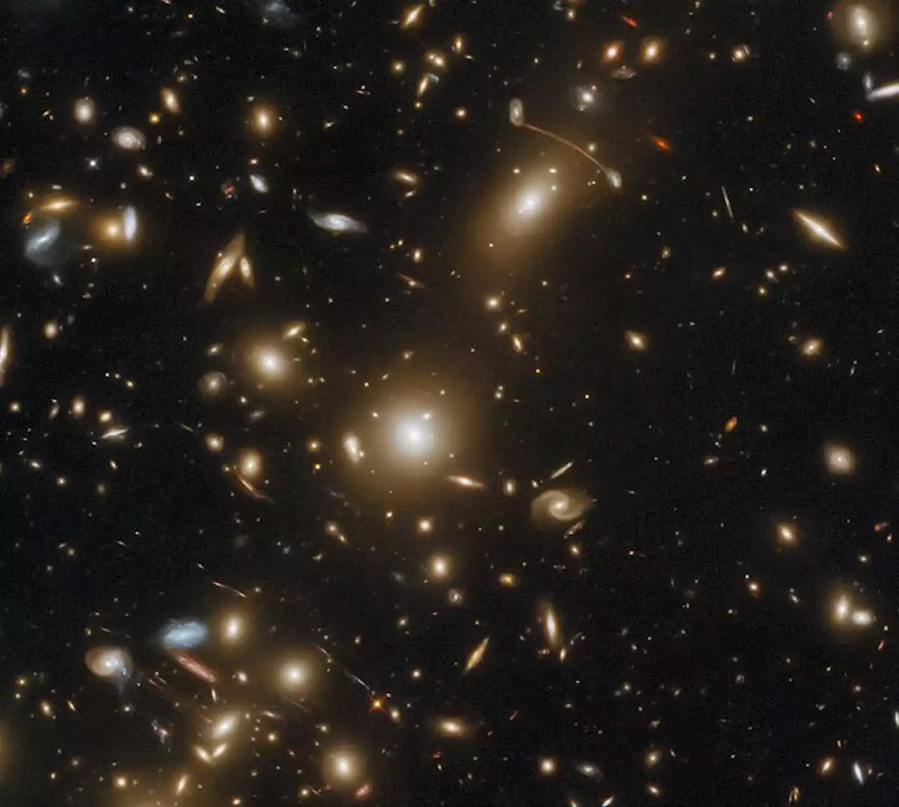 This galaxy cluster is so massive it warps space-time | Digital Trends