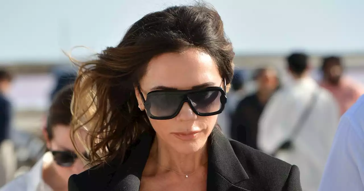 Victoria Beckham endures blustering winds as she attends French fashion preview